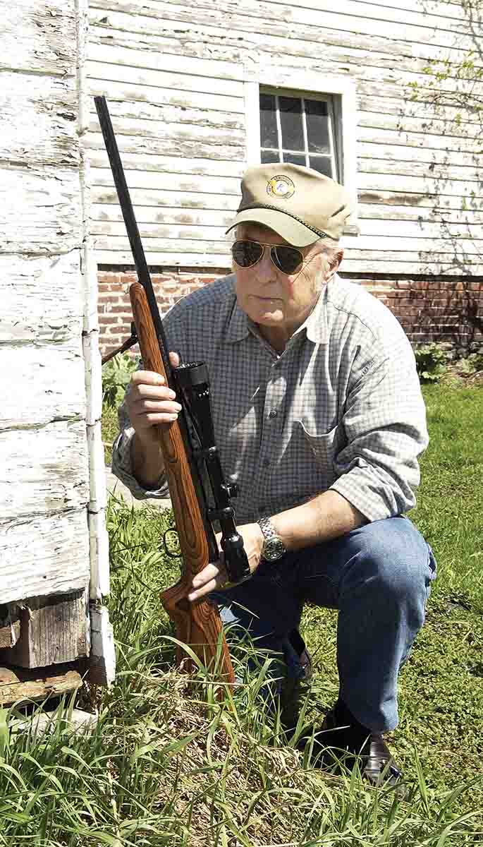 You would be surprised how many woodchucks find a comfortable home under an old barn. With a little patience and his Savage rifle in hand, something will eventually appear on this summer’s afternoon.